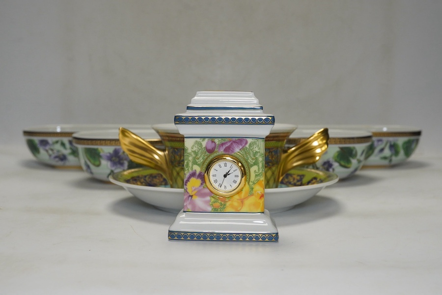 Six Rosenthal for Versace porcelain items; a boxed chocolate cup and saucer, four oblong serving dishes, longest 23cm, and a boxed miniature timepiece, 8.5cm high. Condition - good.